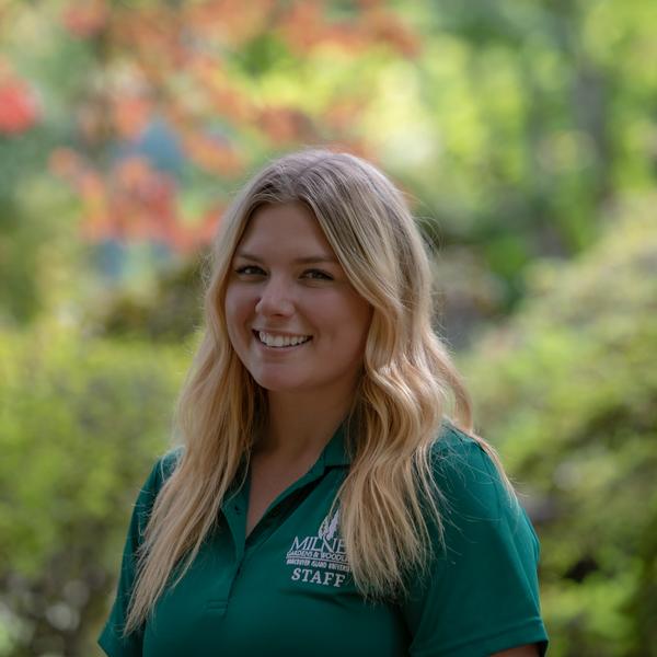 Woman standing in garden posing for a staff photo