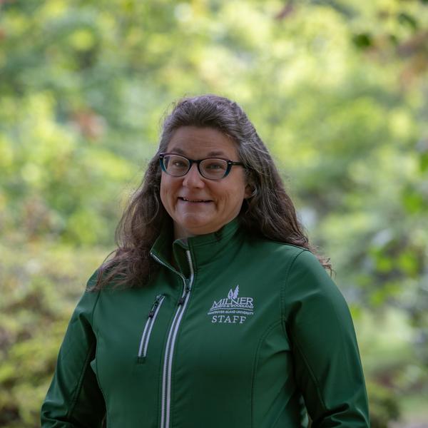 Woman standing in garden posing for a staff photo