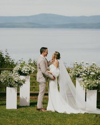 Couple getting married near the ocean.